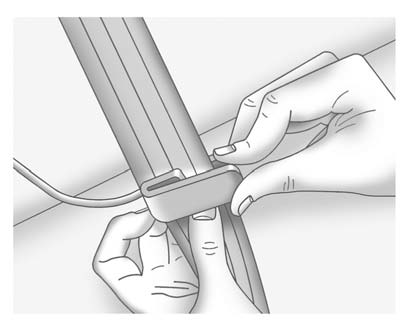 2. Place the guide over the belt, and insert the two edges of the belt into the