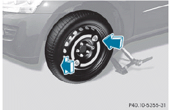 ► Slide the emergency spare wheel onto