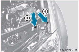 The adjustment screws are located under the