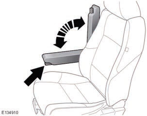 The folding armrest may be stowed by moving to the vertical position. Use the