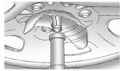 9. Position the center lift point of the jack under the center of the spare tire.