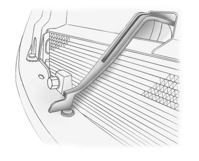 2. At the front of the vehicle, pull up on the bottom center of the grille, and